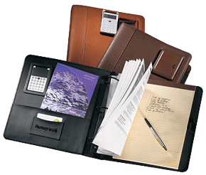 black, brown and tan leather three ring binders with calculators